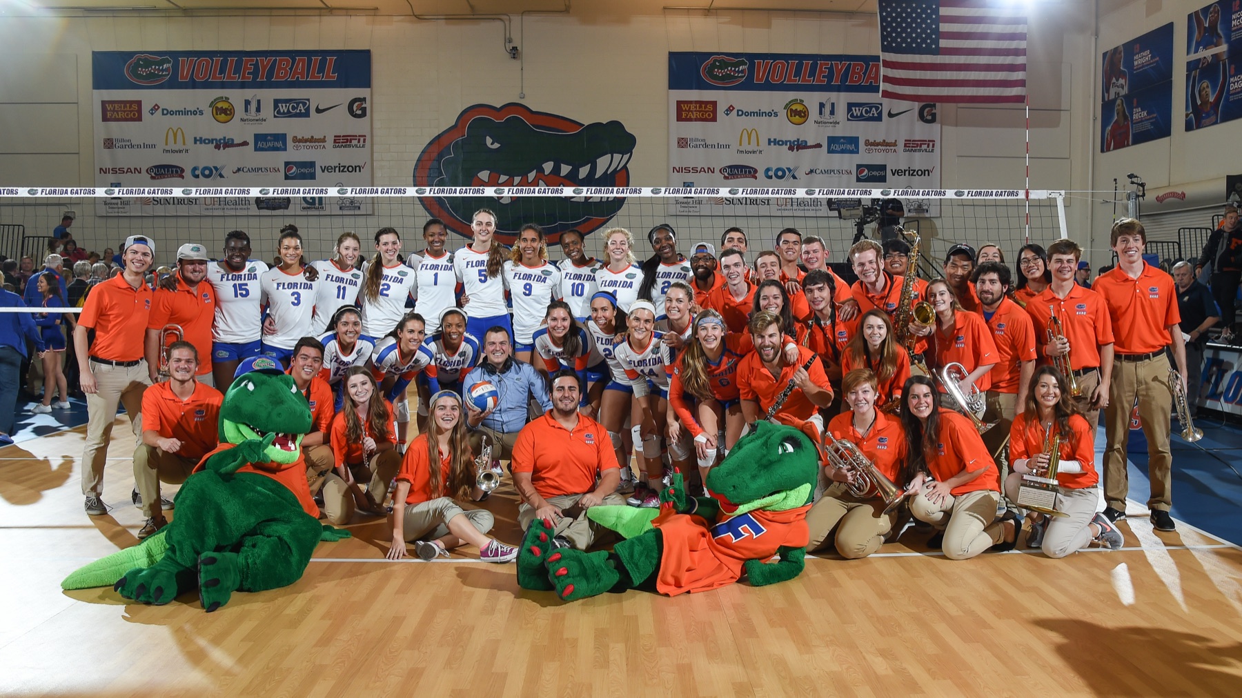 The World's Most Dangerous Volleyball Band with the University of Florida volleyball team and Albert and Alberta Gator on the court at the Lemerand Center after a win over Auburn.
